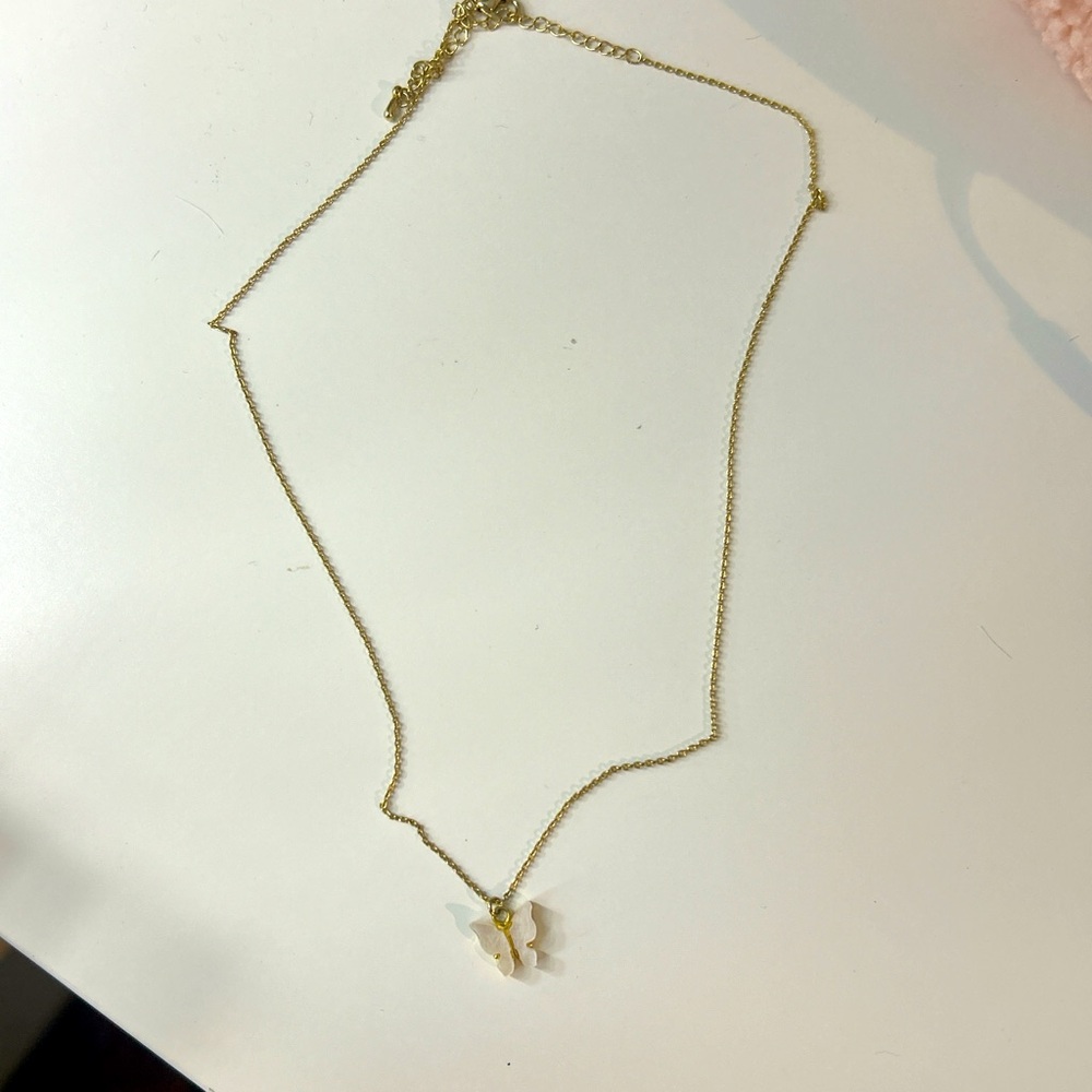 Gold butterfly necklace from Altar’d State
